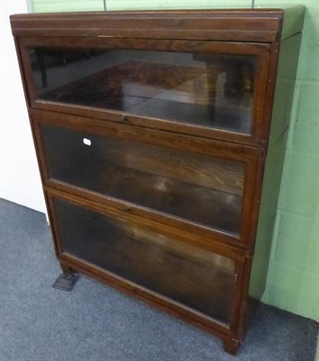 Lot 1352 - A three tier Globe Wernicke oak bookcase