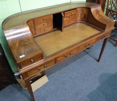 Lot 1369 - A Carlton House style mahogany and satinwood banded writing desk