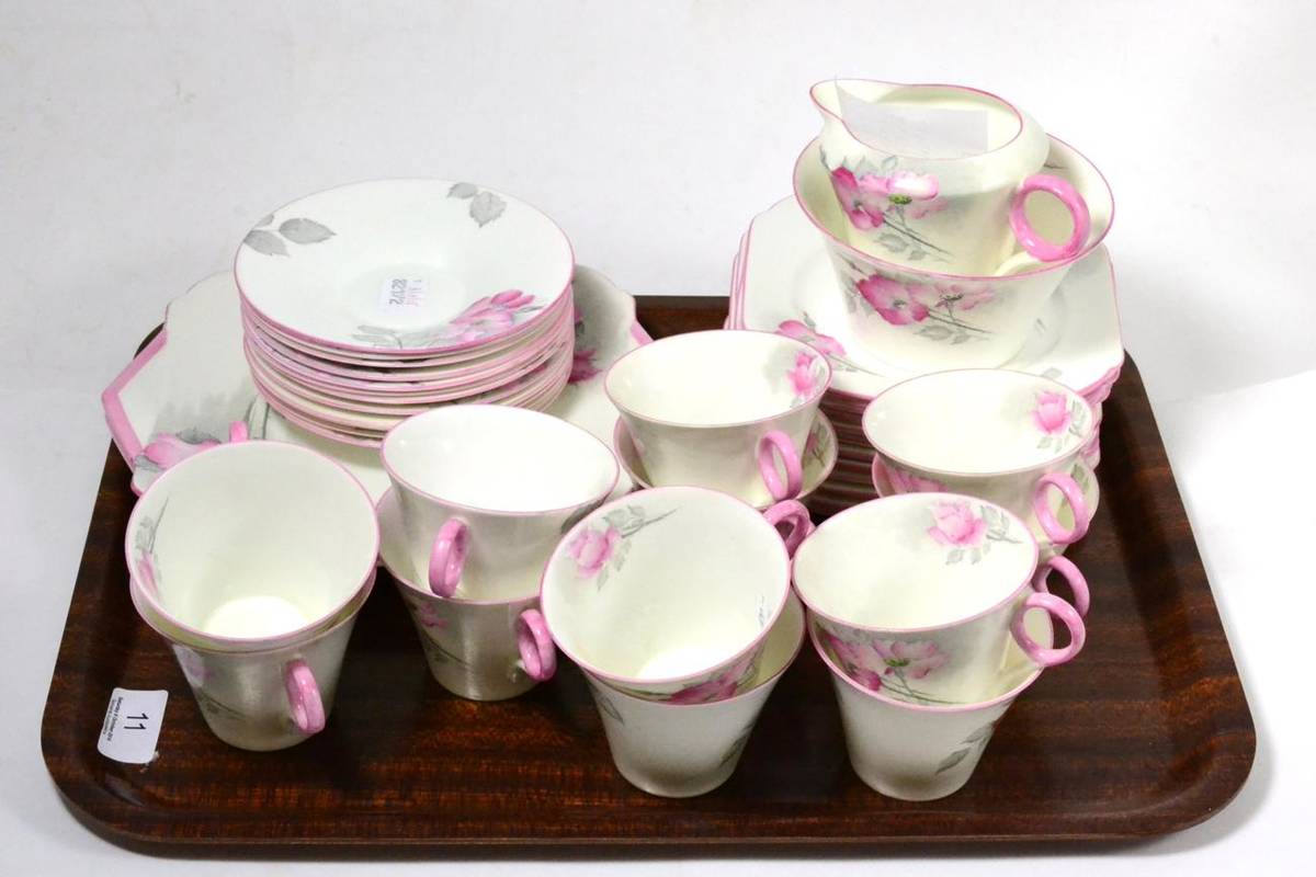 Lot 11 - A Shelley teaset comprising twelve cups and saucers, twelve side plates, milk jug, sugar bowl...
