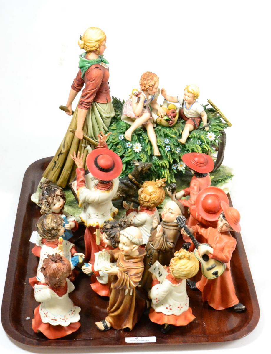 Lot 31 - A set of twelve Capio di Monte Christmas figures of singing monks and children; together with a...