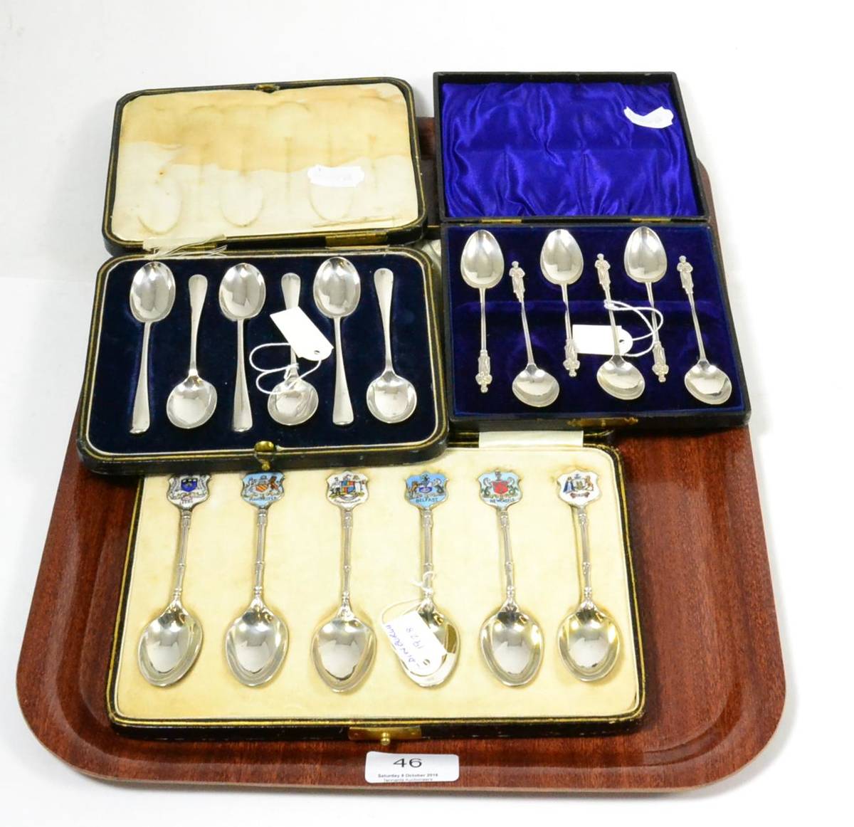 Lot 46 - A set of six silver teaspoons, six silver apostle spoons and a set of six silver spoons with enamel
