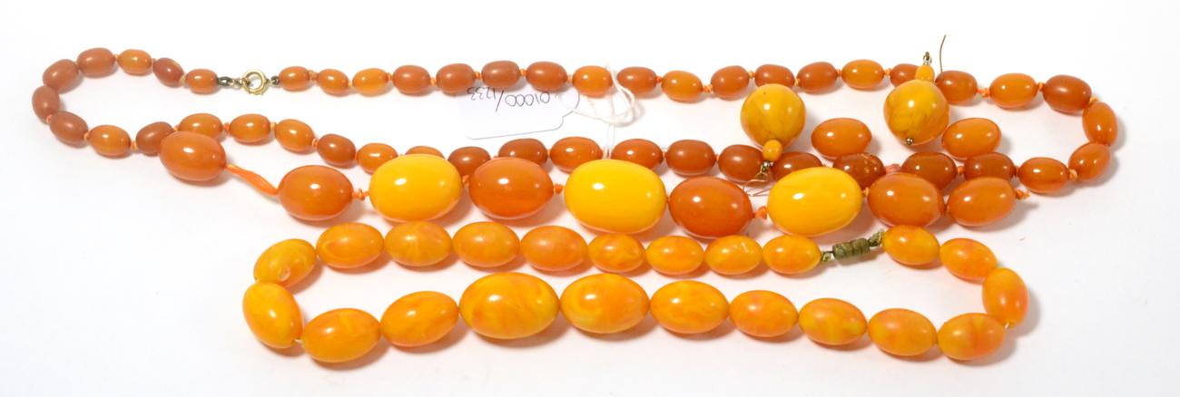 Lot 52 - Simulated amber: including, two necklaces, a part necklace, a pair of drop earrings and two...