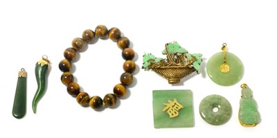 Lot 69 - A small quantity of Oriental jewellery including a silver filigree and green hard-stone brooch,...