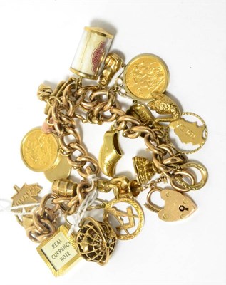 Lot 88 - A charm bracelet stamped ";9ct"; with 9ct gold and other charms and two George V half sovereigns