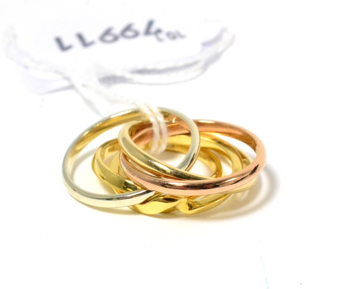Lot 102 - A 9ct three colour gold Russian wedding band and an 18ct gold two bar puzzle ring (2)