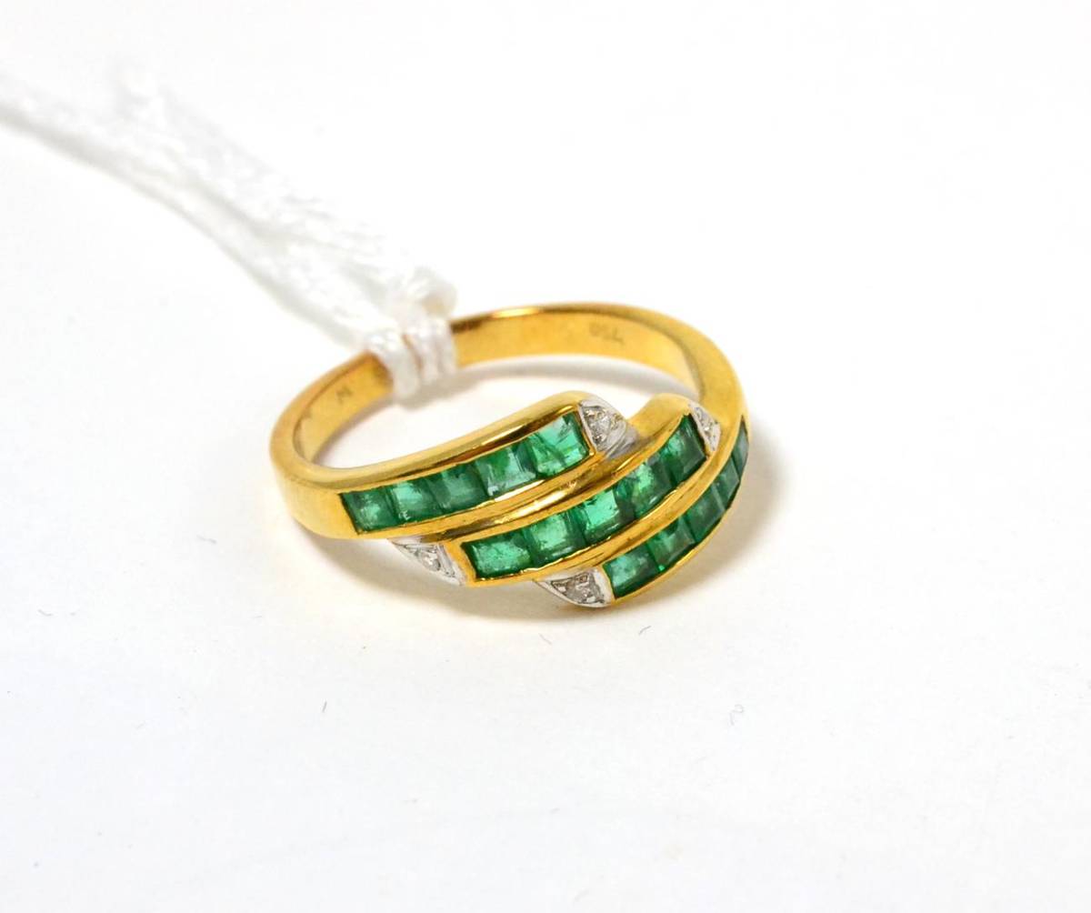Lot 180 - An emerald and diamond three row ring stamped '750'