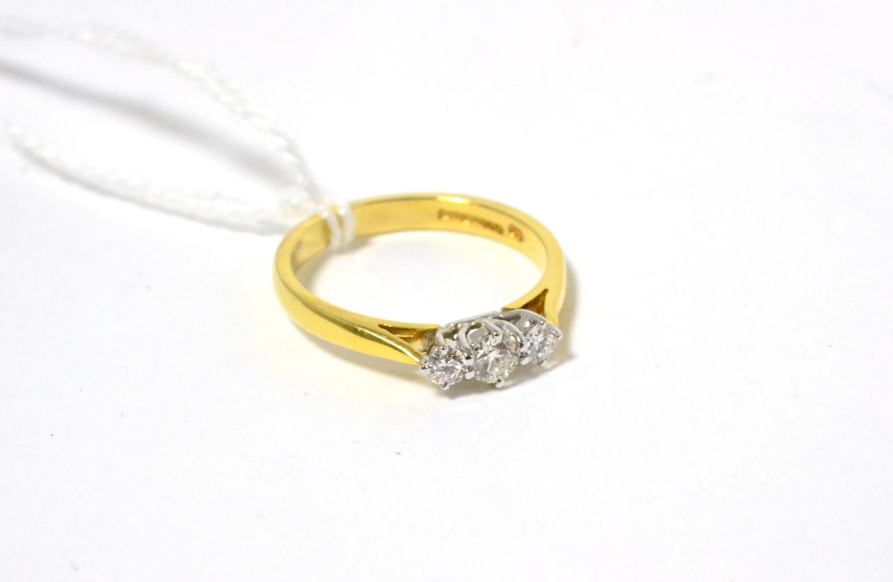 Lot 186 - An 18ct gold diamond three stone ring