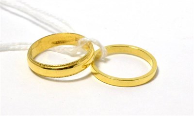 Lot 198 - Two 18ct gold band rings (2)