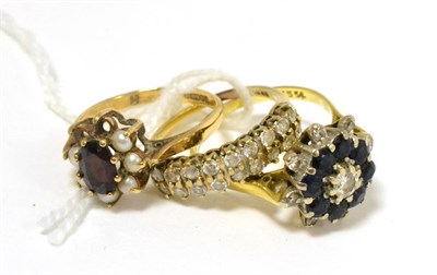 Lot 222 - An 18ct gold diamond and sapphire cluster ring (worn), a 9ct gold cz ring and a 9ct gold garnet and