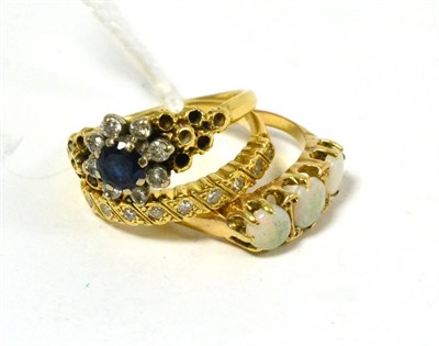 Lot 231 - An 18ct gold diamond set ring, an 18ct gold opal ring and a sapphire and diamond ring (3)