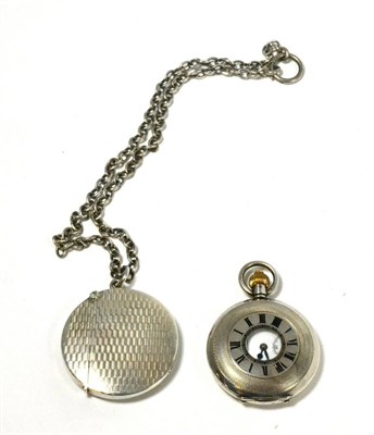 Lot 232 - A 1913 silver vesta case and chain with a French silver half hunter pocket watch (2)