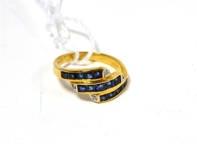 Lot 236 - A sapphire and diamond three row ring stamped '750'