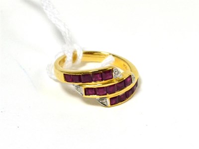 Lot 245 - A ruby and diamond three row ring stamped '750'