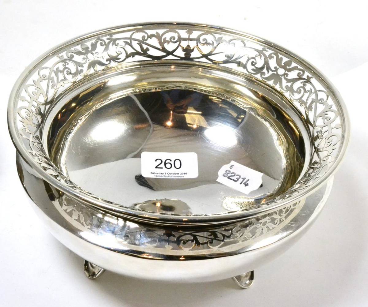Lot 260 - A pierced silver bowl raised on four feet, 20cm diameter by 10cm high