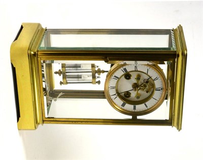 Lot 270 - A brass four glass striking mantle clock