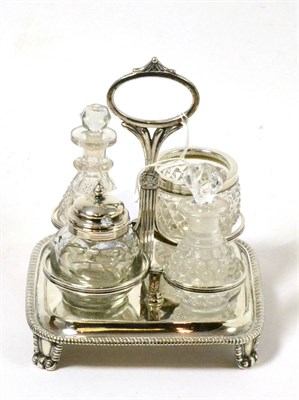 Lot 277 - A silver mounted four piece condiment, Birmingham 1812/19, makers mark MB, on silver stand