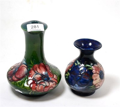 Lot 281 - A Walter Moorcroft Anemone pattern lamp, on a green ground, impressed factory marks, 18.5cm and...