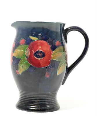 Lot 289 - A William Moorcroft Pomegranate pattern jug, impressed factory marks and facsimile signature,...