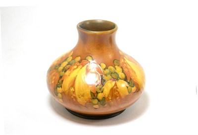 Lot 291 - A William Moorcroft Leaf and Grape pattern vase, under a yellow matt flambe glaze, impressed...