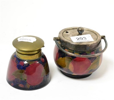 Lot 293 - A William Moorcroft Pomegranate pattern preserve jar, with plated cover and swing handle, impressed