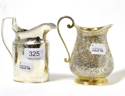 Lot 325 - A Georgian silver cream jug together with a later silver plated example (2)