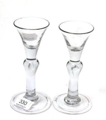 Lot 330 - A pair of George III wine glasses each with teardrop baluster stem