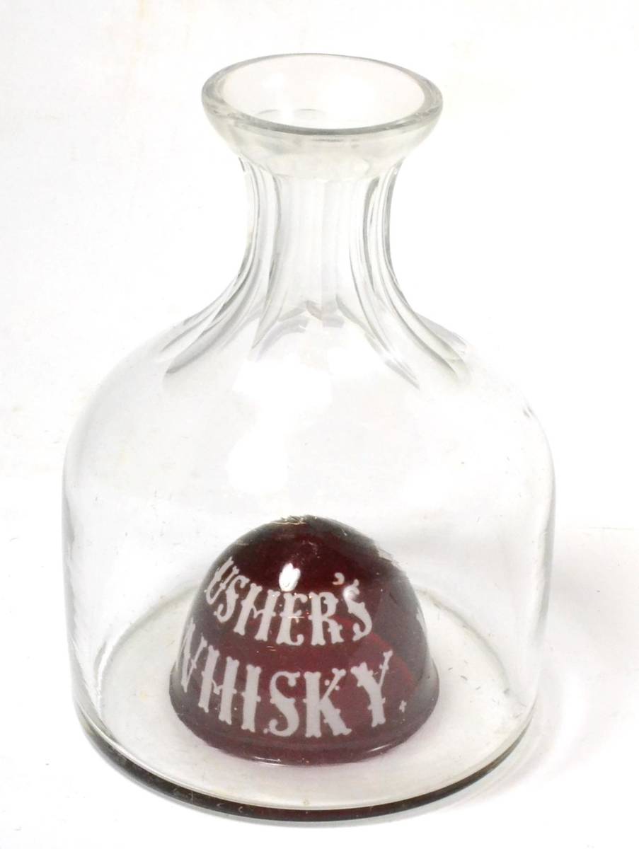 Lot 338 - An early 20th century Ushers Whisky enamelled glass advertising water carafe