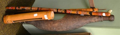 Lot 355 - Scrimshaw decorated bamboo slit drum, a sword stick, two walking sticks and a yoke