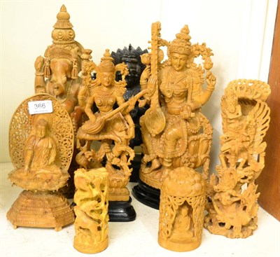 Lot 366 - Five Indian sandalwood deity figures, one other coromandel example and two further sandalwood...