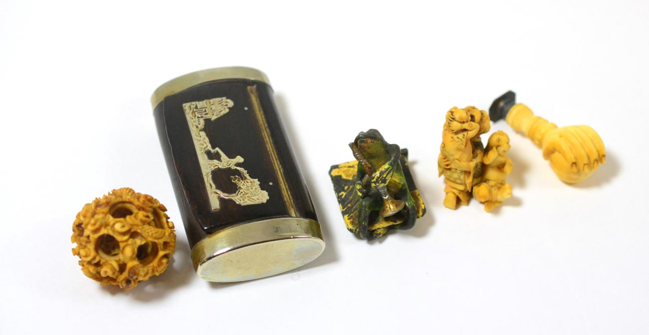 Lot 382 - An ivory seal, puzzle ball, Japanese ivory okimono, circa 1890, painted lead frog and a snuff box