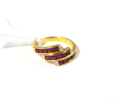 Lot 385 - A ruby and diamond three row ring stamped '750'