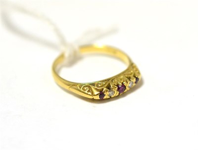 Lot 398 - An 18ct gold ruby and diamond five stone ring