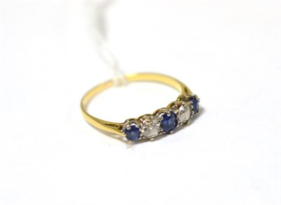 Lot 399 - A sapphire and diamond five stones ring, total estimated diamond weight 0.30 carat approximately