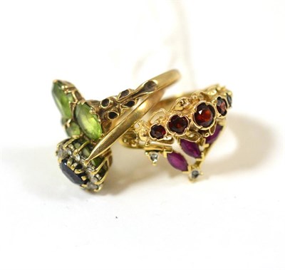 Lot 409 - A 9ct gold peridot ring and three other gem set rings (4)