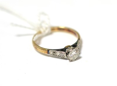 Lot 424 - A diamond solitaire ring with diamond set shoulders, 0.40 carat approximately