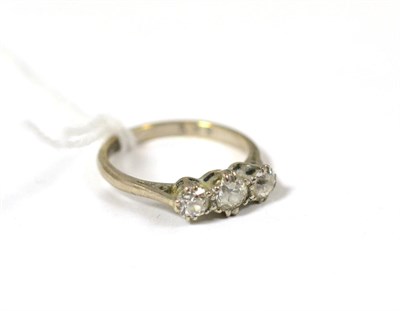 Lot 432 - An old cut diamond three stone ring, total estimated diamond weight 0.90 carat approximately