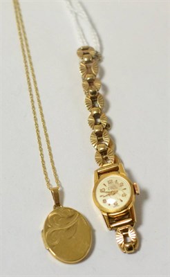 Lot 444 - An 18K lady's Fluva wristwatch together with a 9ct locket on chain (2)