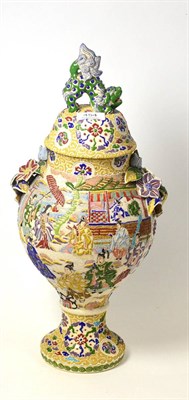 Lot 454 - A Japanese earthenware moriage ware vase and cover, decorated in bright enamels with figures...