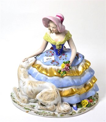 Lot 458 - A Capodimonte figure of a seated girl with a dog