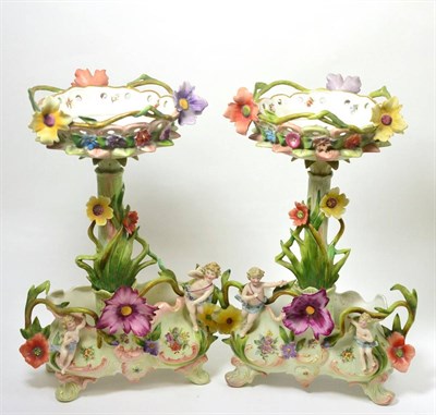 Lot 461 - A pair of German porcelain figural table centrepieces encrusted with flowers