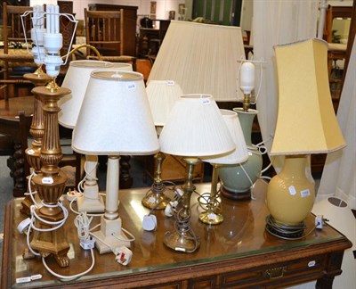 Lot 1059 - Four pairs of table lamps and four individual table lamps together with two brass standard lamps