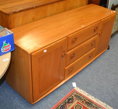 Lot 1086 - An Ercol Windsor elm wood sideboard, after a design by Lucian Ercolani