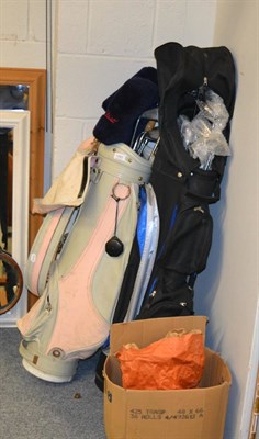 Lot 1093 - Two golf clubs and bags, together with a box of golf balls