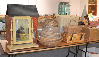 Lot 1103 - A quantity of various wicker baskets, a rug, a painted toilet mirror with a dolls house