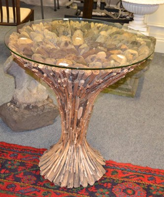 Lot 1177 - Modernist drift wood table with circular glass top