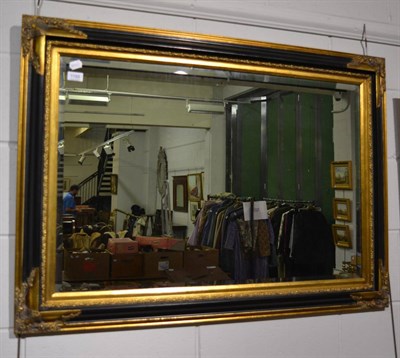 Lot 1188 - Parcel gilt and part ebonised rectangular mirror (modern)