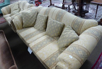 Lot 1191 - A Lincoln House modern three piece suite, comprising a pair of sofas and a wingback chair