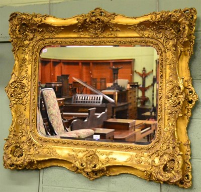 Lot 1281 - A rectangular gilt mirror in Rococco taste