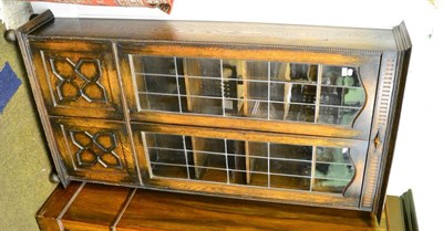 Lot 1295 - An oak leaded bookcase