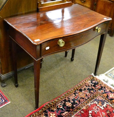 Lot 1312 - A George III mahogany serpentine side table